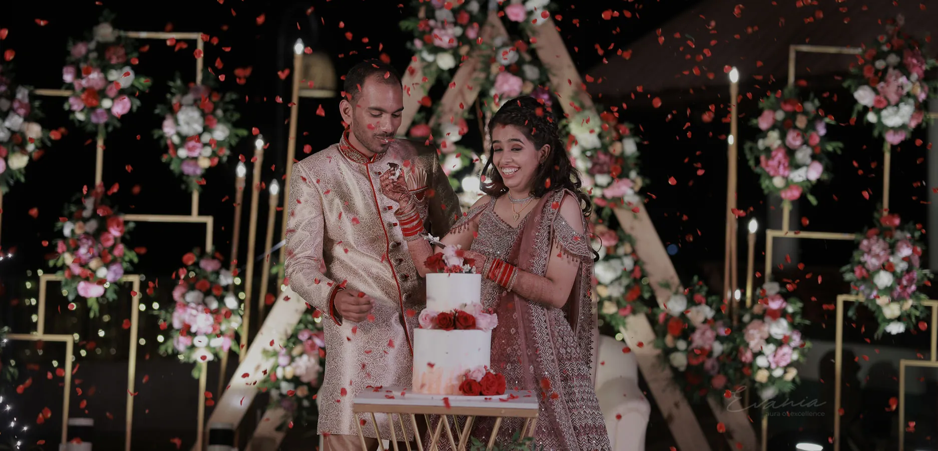 Couple celebrating at a decorated wedding reception
